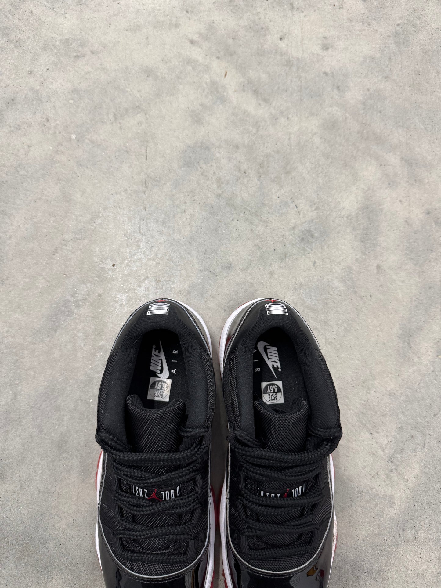 JORDAN 11 LOW “ Bred “