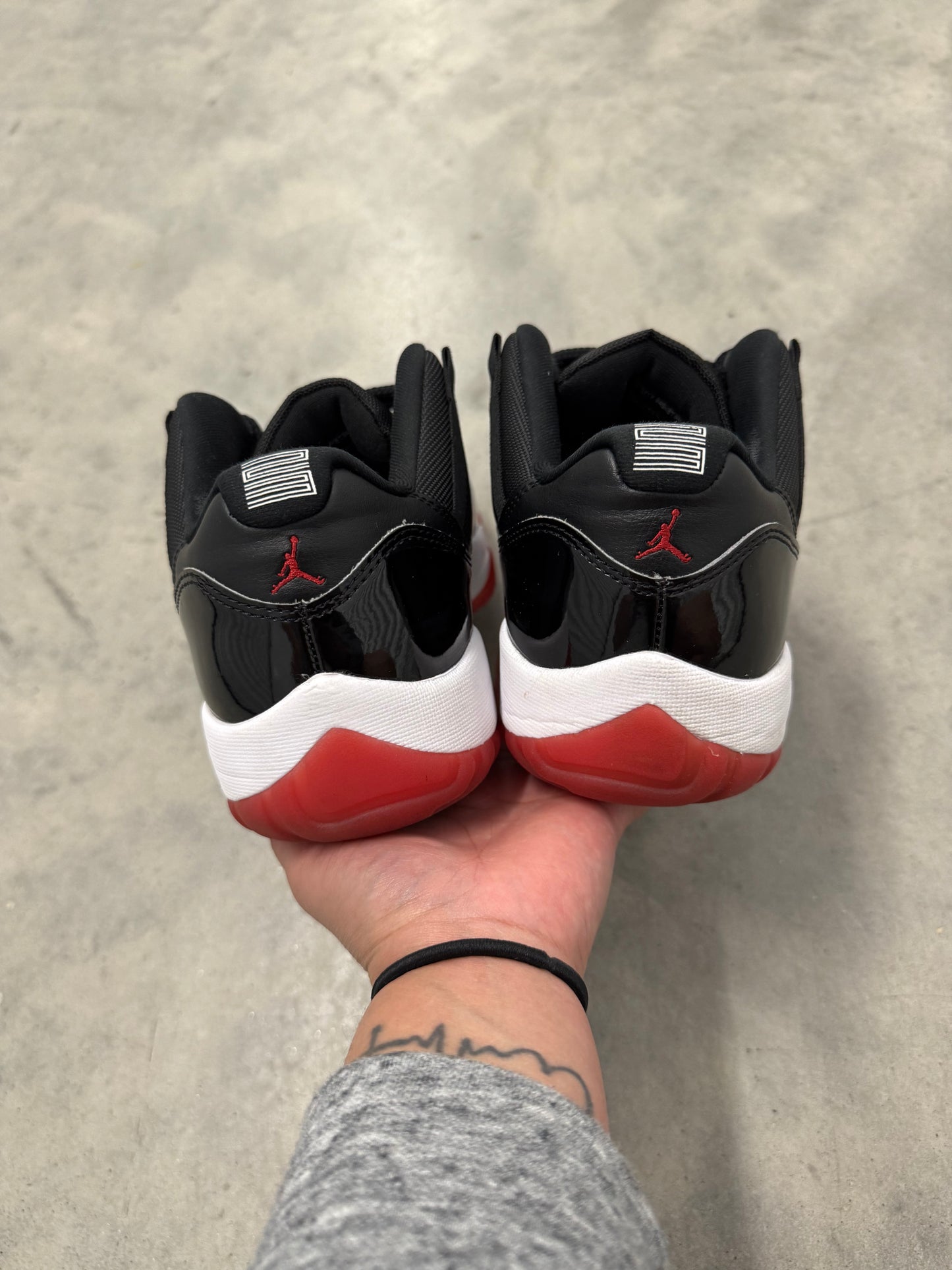 JORDAN 11 LOW “ Bred “