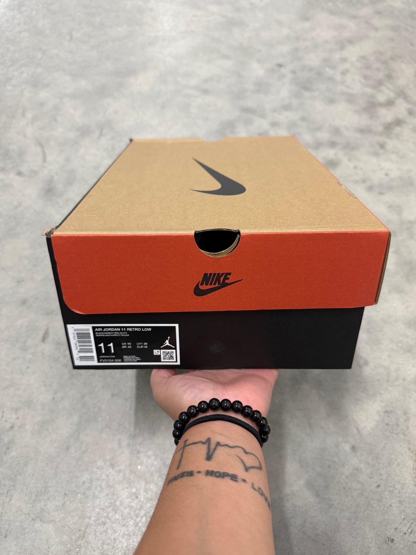 JORDAN 11 LOW “ Bred “