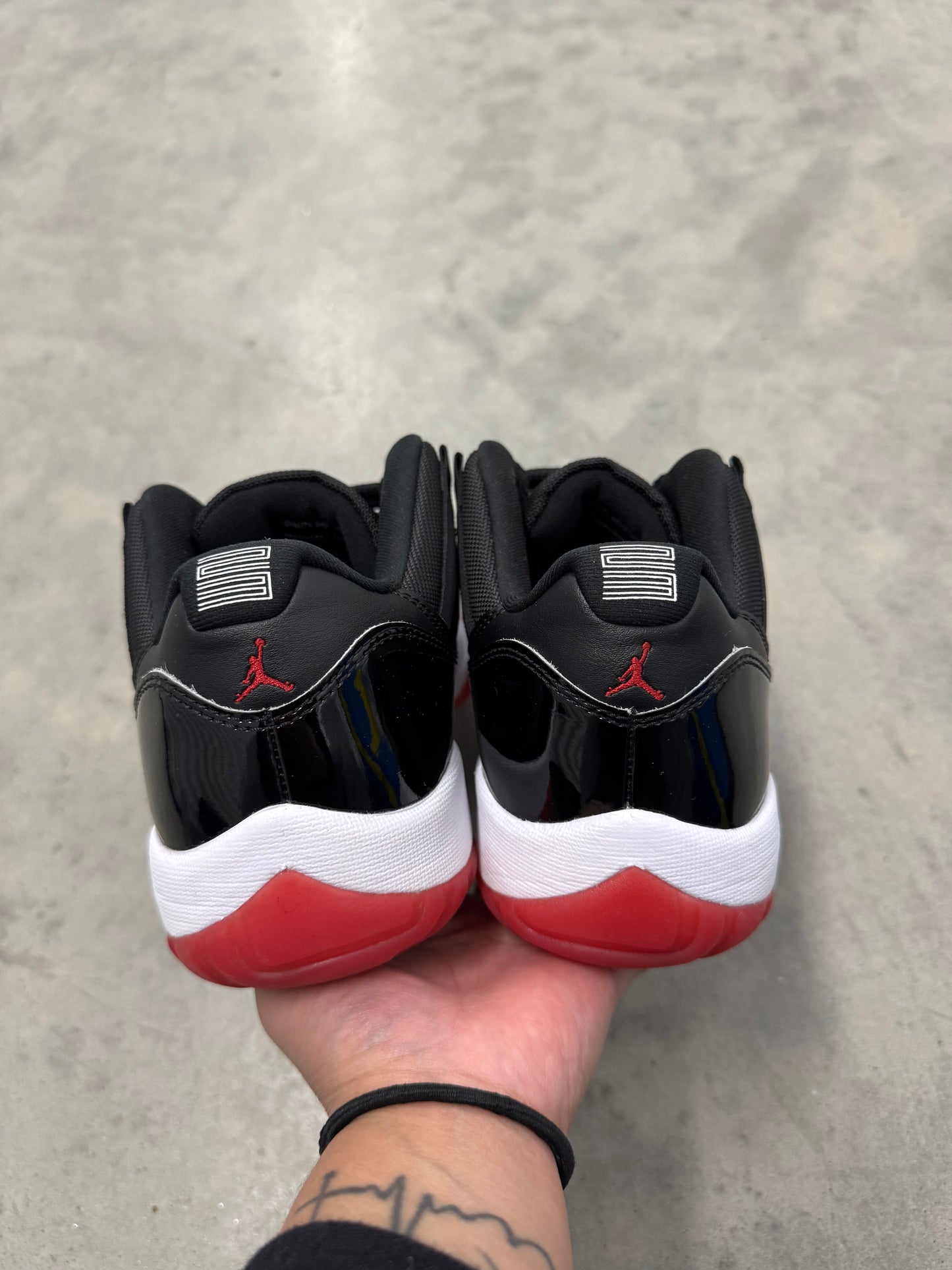 JORDAN 11 LOW “ Bred “