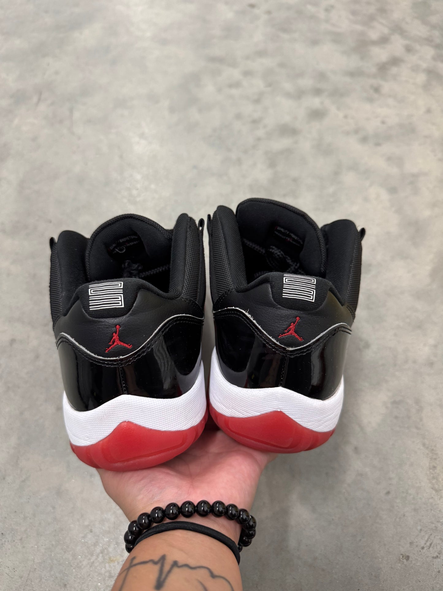 JORDAN 11 LOW “ Bred “
