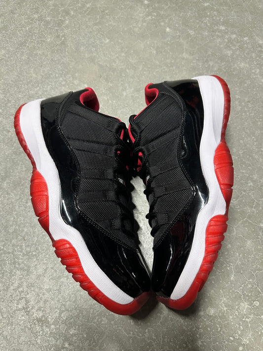 JORDAN 11 LOW “ bred “