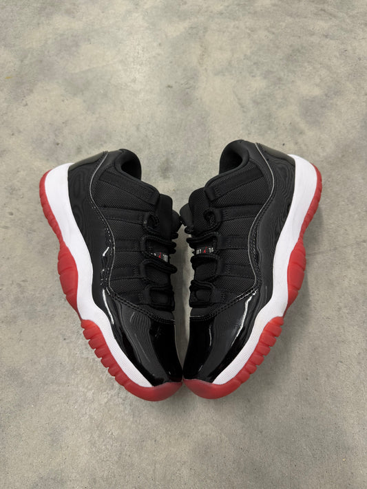 JORDAN 11 LOW “ Bred “