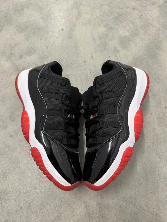 JORDAN 11 LOW “ Bred “
