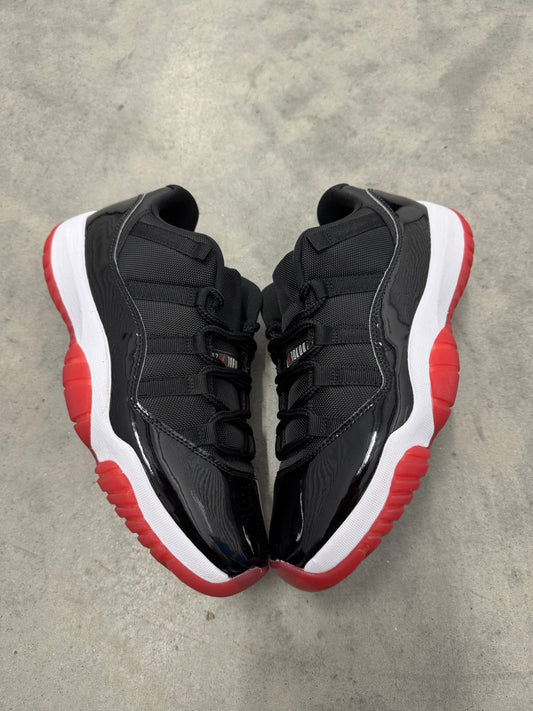 JORDAN 11 LOW “ Bred “