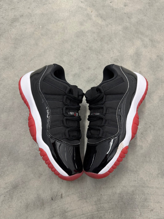 JORDAN 11 LOW “ Bred “