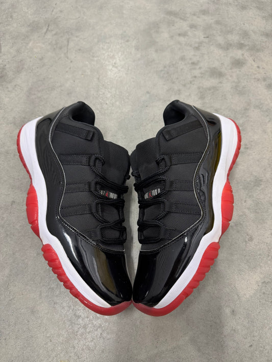 JORDAN 11 LOW “ Bred “